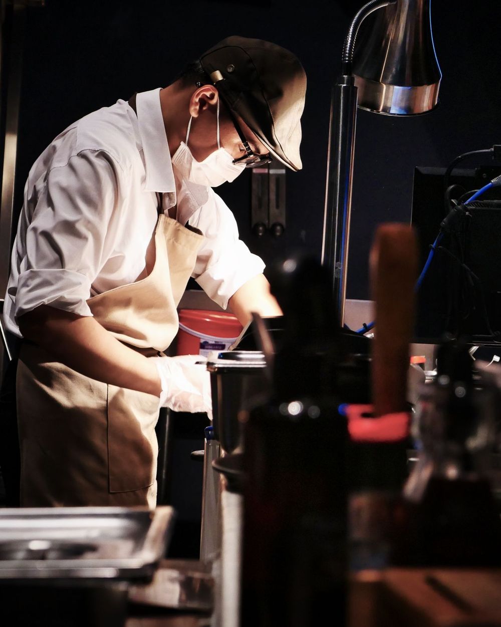Chefs preparing dishes in a restaurant kitchen