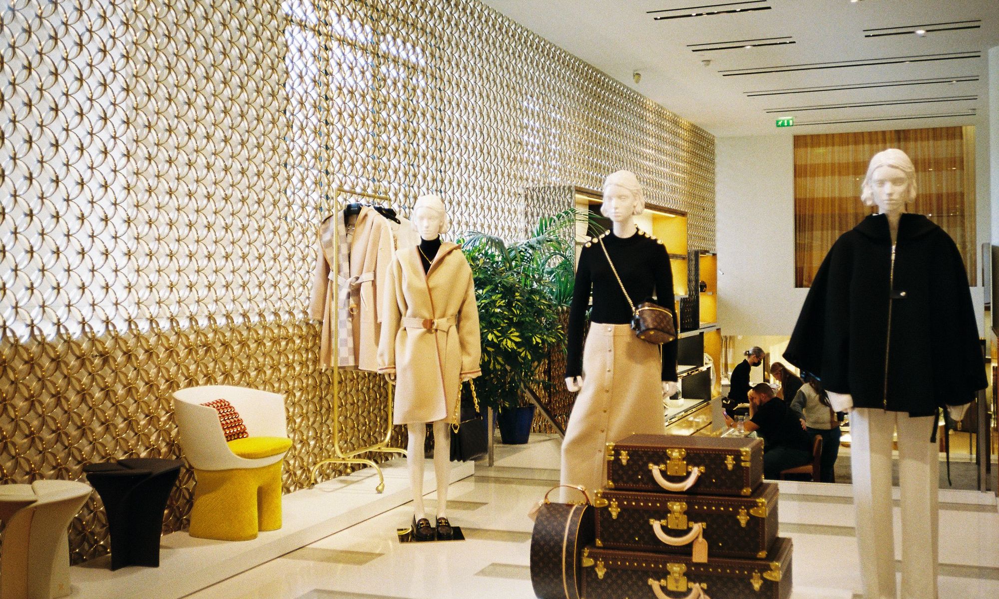 The interior of a fashion store with displays and mannequins