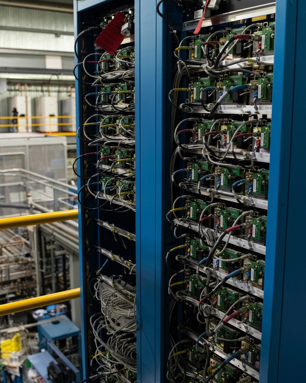Rows of servers wired into a data center rack